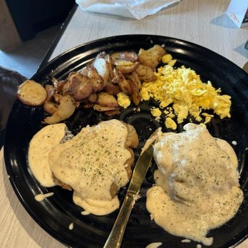 Biscuit & Hogs - Biscuit and gravy, home fries, eggs (1/2 portion, we shared it!) - New American Near Me - Meridian, Idaho