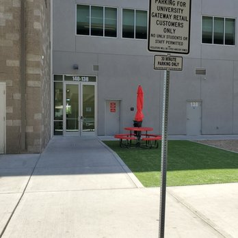 Brew Tea Bar - Back exit (not an entrance), and the sign of one of many free parking spots in the garage. Entrance on the side street (Dorothy). - Bubble Tea Near Me - Las Vegas, Nevada