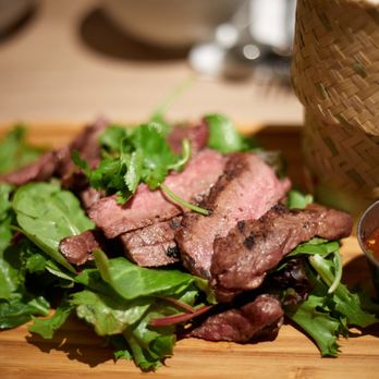 White Elephant - steak and greens on a cutting board - Thai Near Me - San Diego, California