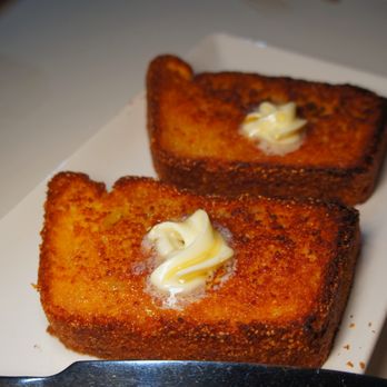 Kapa Hale - corn bread with lilikoi butter and honey - Hawaiian Near Me - Honolulu, Hawaii Kapa Hale - corn bread with lilikoi butter and honey - Hawaiian Near Me - Honolulu, Hawaii