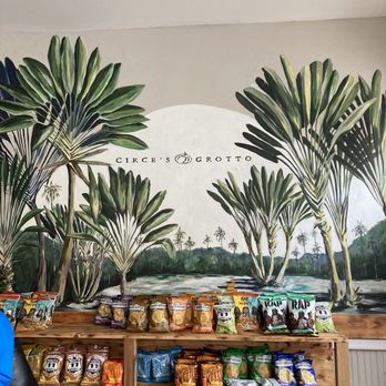 Circe's Grotto - a man standing in front of a store - Sandwiches Near Me - Charleston, South Carolina