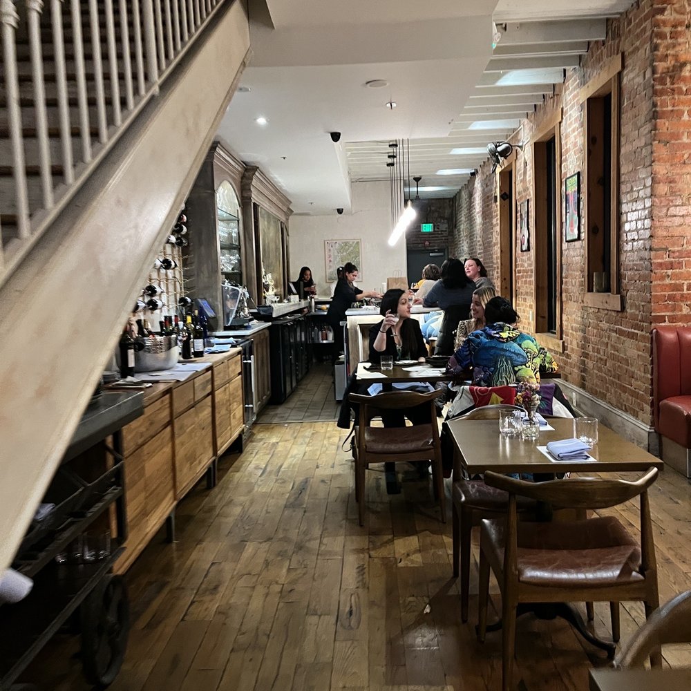 Cynthia - people sitting at tables in a restaurant - New American Near Me - Washington, DC, District of Columbia