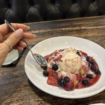 H H Cotton's - Delicious warm butter cake with vanilla ice cream and berries - Sports Bars Near Me - San Clemente, California