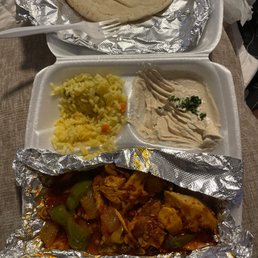 Spicy Mediterranean Chicken with hummus, pita bread and yellow rice!