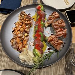 Ro Sushi - Daybreak salmon and yellowtail belly, Prime Cut stacked with tuna belly and roe, and Smokey Flame with shrimp tempura and smoked salmon.
