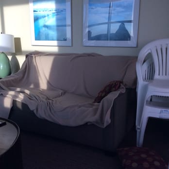Seaside Resort - Living Rm. in a 3 bd. condo. The rm houses 6 people at least. Seating for 3 in this space. Felt more sanitary to have a blanket - Hotels Near Me - North Myrtle Beach, South Carolina Seaside Resort - Living Rm. in a 3 bd. condo. The rm houses 6 people at least. Seating for 3 in this space. Felt more sanitary to have a blanket - Hotels Near Me - North Myrtle Beach, South Carolina