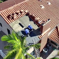 OC Roof Contractors - Clay roof repair in progress - restoring durability and appearance for this home in Orange. Quality craftsmanship, tile by tile.