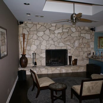 William Davidson Interiors - a living room with a stone fireplace - Interior Design Near Me - Los Angeles, California William Davidson Interiors - a living room with a stone fireplace - Interior Design Near Me - Los Angeles, California