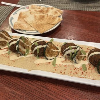 Pom & Olive - Falafel appetizer was beautifully plated and so delicious. Really good falafel plus some zucchini slices that were unreal - New American Near Me - Newport Beach, California