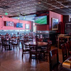 Large Dining room with lots of tv