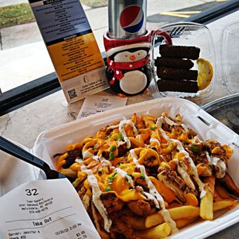 Town Kitchen Restaurant - a tray of fries and a can of soda - Halal Near Me - Melvindale, Michigan
