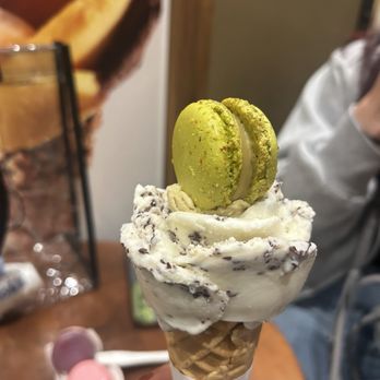 Amorino - Stracciatella and pistachio gelato rose. In their signature style. Pistachio macaron on top - Gelato Near Me - San Francisco, California