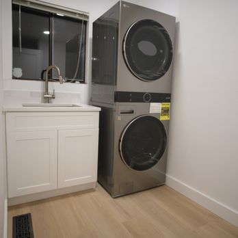 Interactive Remodeling - a washer and dryer in a laundry room - General Contractors Near Me