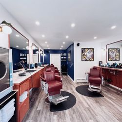 Clara Barber  - Unwind with hot towels, enjoy a complimentary open bar, and vibe to Sonos surround sound while sparking great conversations. Book Now!
