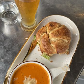 Three Birds Cafe - Chicken salad croissant and tomato soup, along with a beer by local brewer Crooked Can. - Cafes Near Me - Winter Garden, Florida