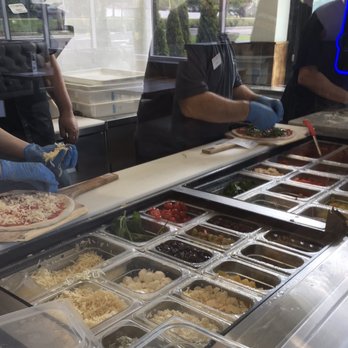 Woodgrain Pizzeria - Pizza customization prepared in sight. - Pizza Near Me - O'fallon, Missouri Woodgrain Pizzeria - Pizza customization prepared in sight. - Pizza Near Me - O'fallon, Missouri