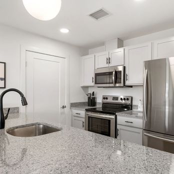 Bonacio Management - Stainless steel appliances and solid surface countertops are featured in the kitchens of Air City Lofts - Property Management Near Me - Saratoga Springs, New York Bonacio Management - Stainless steel appliances and solid surface countertops are featured in the kitchens of Air City Lofts - Property Management Near Me - Saratoga Springs, New York