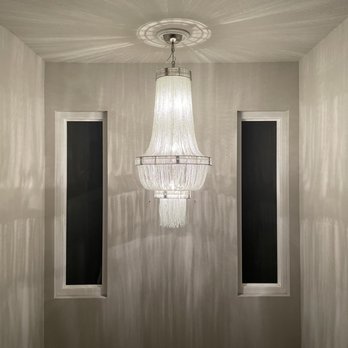 T1 Electric & Security - Chandelier installation in staircase - Security Systems Near Me T1 Electric & Security - Chandelier installation in staircase - Security Systems Near Me