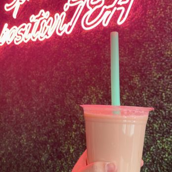 SereniTea Gourmet Bubble Tea - a hand holding a cup - Bubble Tea Near Me - Glendale, Wisconsin