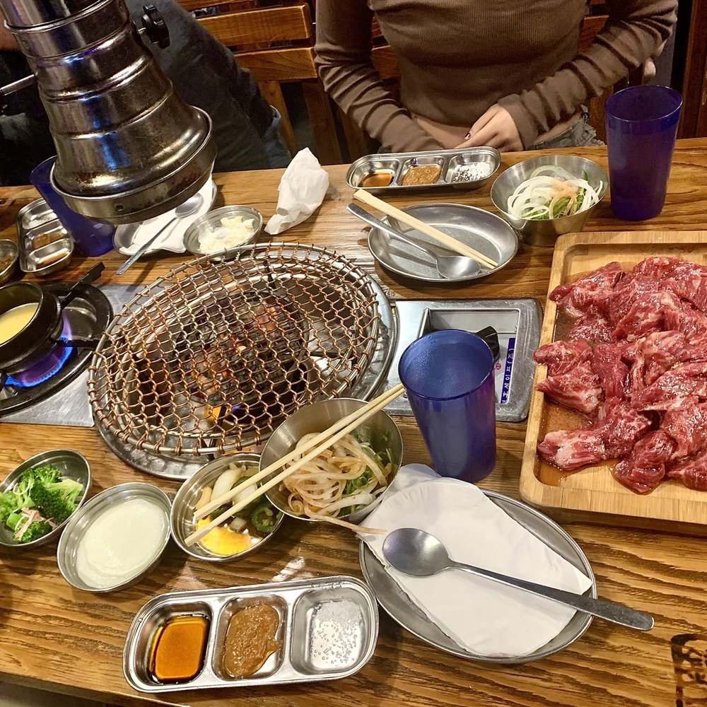 Jongro BBQ Flushing - Prime Marinated Kalbi for $38.99 per portion.  5* Pictured is 4 portions ($155 worth) on the tray.  Steamed egg is heating up on the left. - Korean Near Me - Flushing, New York