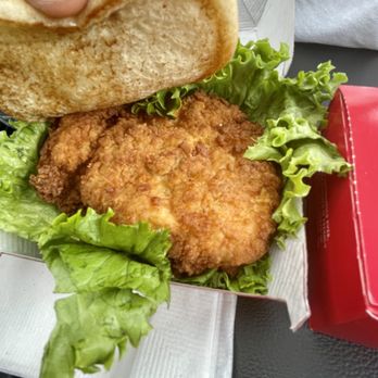 Chick-fil-A - ows a hand holding a sandwich - Fast Food Near Me - Grand Junction, Colorado