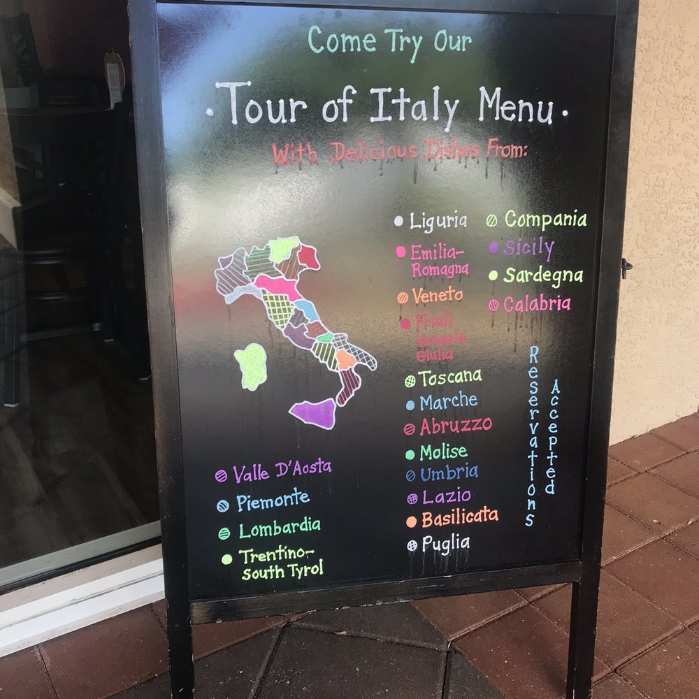 Cafe Italia - a sign for the tour of italy menu - Italian Near Me - Sanibel, Florida