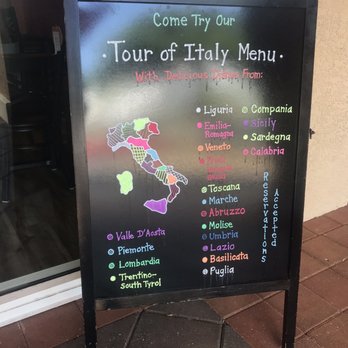 Cafe Italia - a sign for the tour of italy menu - Italian Near Me - Sanibel, Florida