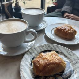 We split a chocolate croissant and each of us had a large latte.