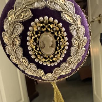The Real McCoy Thrift Store - Purple velvet ball with cameo surrounded by pearls and embossed lace. - Thrift Stores Near Me - Jackson, Mississippi