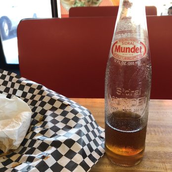 Taqueria Los Angeles - a bottle of mundent soda and a napkin on a table - Mexican Near Me - Peoria, Arizona Taqueria Los Angeles - a bottle of mundent soda and a napkin on a table - Mexican Near Me - Peoria, Arizona