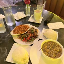 The African Soul Food Restaurant - Mbuzi Wet Fry (Fried Goat Meat) Jollof Rice (Red Spicy Rice) Fufu (Pounded Yam)Egusi Soup