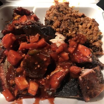 Klumzy BBQ - Pork ribs, tri-tip and a side of baked beans. Sauce on top. It all went into the trash after a few bites back at the hotel. - Barbeque Near Me - San Bernardino, California