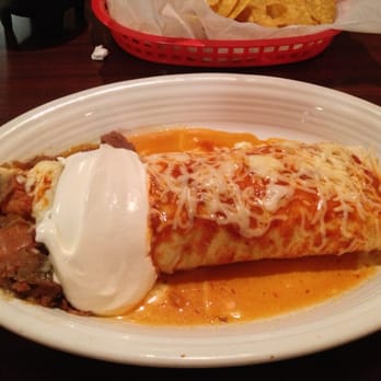 The Toros - Hot and Spicy Burrito. Actual size is equal to a man's shoe. - Mexican Near Me - Brownsburg, Indiana The Toros - Hot and Spicy Burrito. Actual size is equal to a man's shoe. - Mexican Near Me - Brownsburg, Indiana