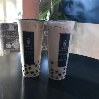 Tea 18 - Oolong Milk Tea with boba on the left and taro milk tea with taro and boba on the right. - Bubble Tea Near Me - Sacramento, California Tea 18 - Oolong Milk Tea with boba on the left and taro milk tea with taro and boba on the right. - Bubble Tea Near Me - Sacramento, California