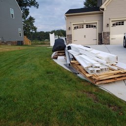 Trash still sittingbthere after 7 days. Workers left it all over the place, on the grass, street, driveway. we piled it up