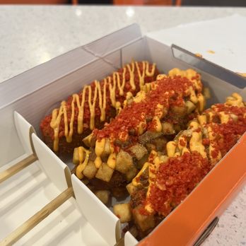Two Hands Corn Dogs - Spicy Dog (left) and Potato Dog (middle/right) - Korean Near Me - Torrance, California Two Hands Corn Dogs - Spicy Dog (left) and Potato Dog (middle/right) - Korean Near Me - Torrance, California