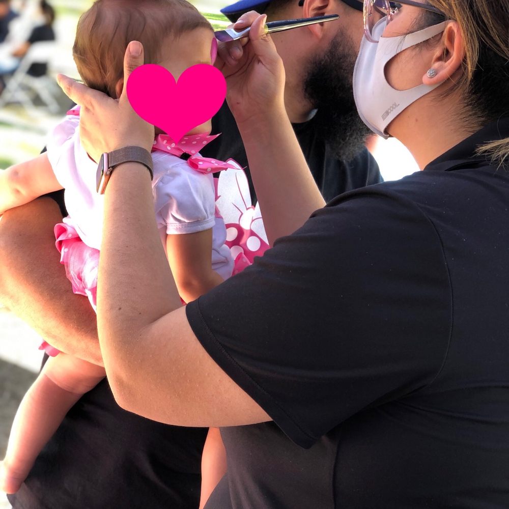 Painting baby's face (half) Painting baby's face (half)