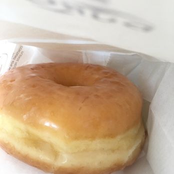 Swiss Donuts - a glazed donut in a paper bag - Donuts Near Me - Palm Desert, California
