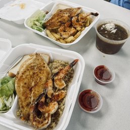Grilled shrimp and grilled red snapper with a bowl of gumbo. Grilled shrimp and grilled red snapper with a bowl of gumbo.