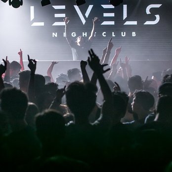 Levels Nightclub - a crowd of people raising their hands in the air - Dance Clubs Near Me - Vancouver, British Columbia