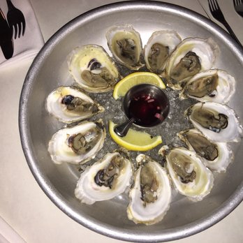 Brasserie Bernard - a dozen of fresh oysters, with lemon and mignonette - French Near Me - Montreal, Quebec Brasserie Bernard - a dozen of fresh oysters, with lemon and mignonette - French Near Me - Montreal, Quebec