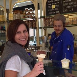 Gelateria Loggetta - My cone with their famous vanilla and chocolate on top.  My husbands pistachio on the counter. Nicolò became a fast friend.
