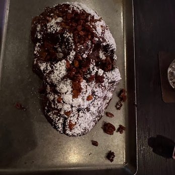 Voodoo Bayou - The skull shaped monkey bread, drizzled with salted caramel and pralines. - Cocktail Bars Near Me - Orlando, Florida