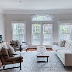 Decorelle Interior Design Studio - Open and airy living room with custom window shades.