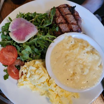 Le Sel Bistro - Steak with eggs, arugula salad, and cheesy grits! Oh so good! - Breakfast & Brunch Near Me - Tacoma, Washington Le Sel Bistro - Steak with eggs, arugula salad, and cheesy grits! Oh so good! - Breakfast & Brunch Near Me - Tacoma, Washington