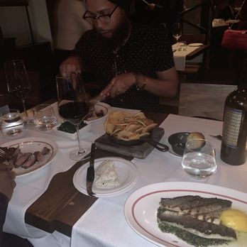 Quality Meats - Mediterranean branzino and filet mignon with sautéed spinach and roasted potatoes. - Steakhouses Near Me - New York, New York Quality Meats - Mediterranean branzino and filet mignon with sautéed spinach and roasted potatoes. - Steakhouses Near Me - New York, New York