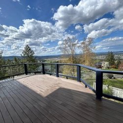 Master Build Construction & Handyman Services - Installation of railing system with glass pane inserts.