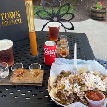 Town Branch Distillery - a plate of nachos and a drink - Distilleries Near Me - Lexington, Kentucky Town Branch Distillery - a plate of nachos and a drink - Distilleries Near Me - Lexington, Kentucky