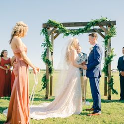 JM Prosperity Farm Rustic Barn Venue - Outdoor ceremony arch and vows.