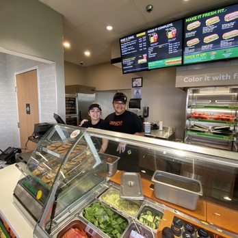 Subway - a man and a woman behind a counter - Sandwiches Near Me - Boron, California Subway - a man and a woman behind a counter - Sandwiches Near Me - Boron, California